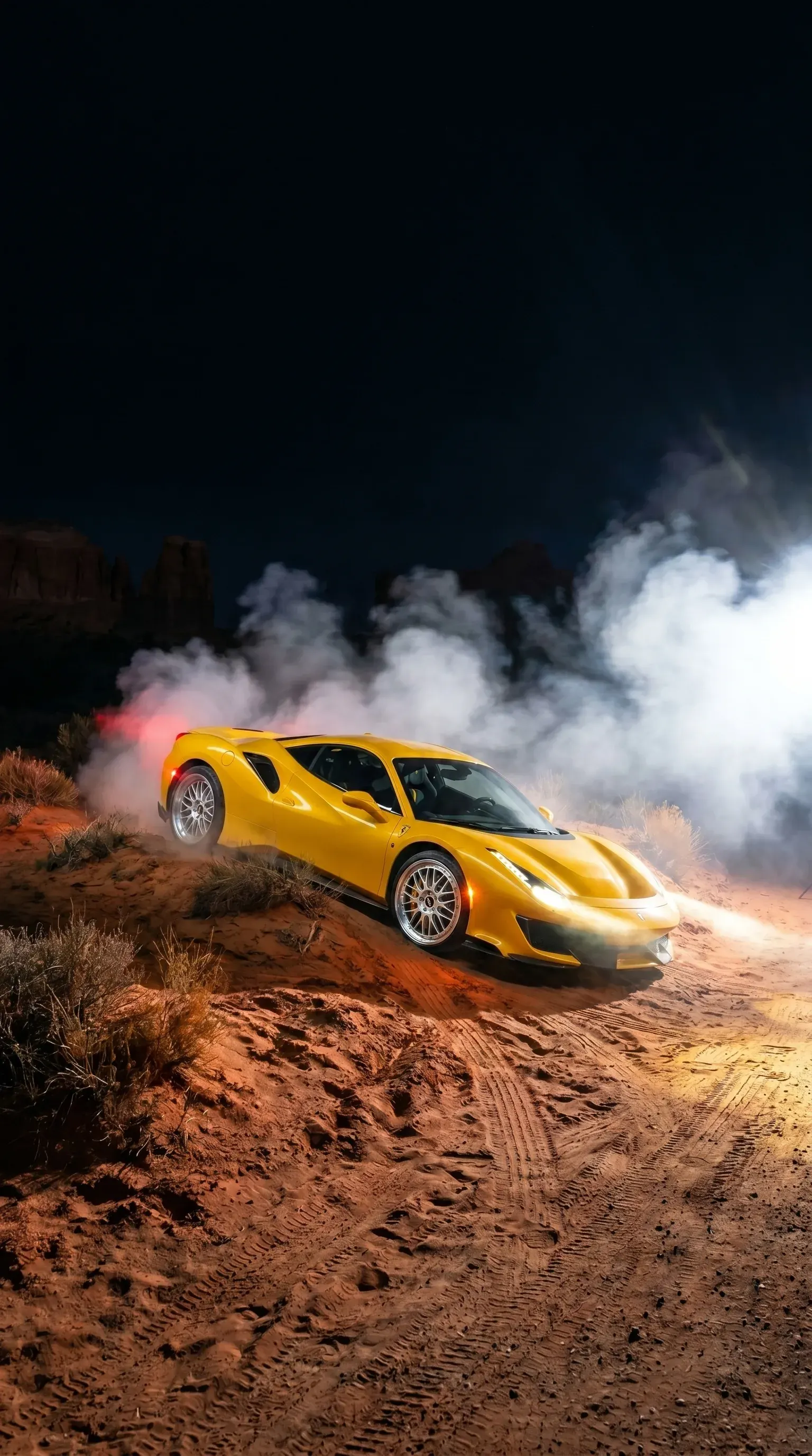 Yellow Ferrari 488 kicking up smoke in the desert with bright multi-spoke aftermarket wheels