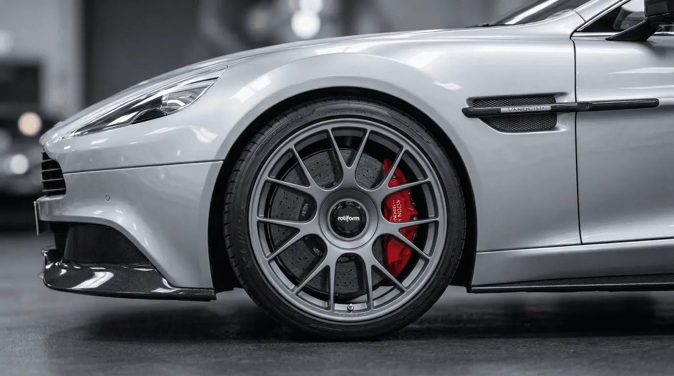 Aston Martin with custom black wheel fitment render