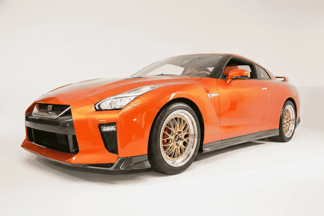Orange Nissan GT-R with the gold multi-spoke wheels fitted